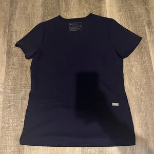 Like new navy blue Figs Casma Three pocket top